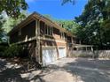 A two-story house with a fenced backyard and a two-car garage at 4968 Twin Branches Way, Dunwoody, GA 30338