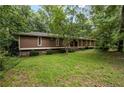 Expansive front yard and exterior view of this warm, inviting home at 4968 Twin Branches Way, Dunwoody, GA 30338