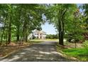 View of the house from the private drive at 833 Hines Rd, Moreland, GA 30259