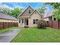 Charming craftsman-style home with a well-manicured front yard and inviting porch at 2005 Chicago Nw Ave, Atlanta, GA 30314