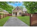 Charming craftsman-style home with a well-manicured front yard and long driveway at 2005 Chicago Nw Ave, Atlanta, GA 30314