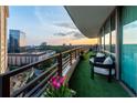 Beautiful balcony with outdoor seating and city views, perfect for relaxing or entertaining at 700 Park Regency Ne Pl # 1605, Atlanta, GA 30326