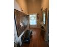 Inviting entryway with hardwood floors and tastefully decorated with a large painting and decorative mirror at 413 W Wind Dr, Villa Rica, GA 30180