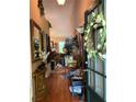 Welcoming entryway featuring hardwood floors and decor, leading into a cozy living space at 413 W Wind Dr, Villa Rica, GA 30180