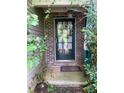 Inviting front entrance with a decorative wreath and a stylish black-framed glass door at 413 W Wind Dr, Villa Rica, GA 30180