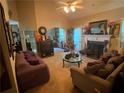 Cozy living room featuring a fireplace, comfortable seating, and a bright, airy ambiance at 413 W Wind Dr, Villa Rica, GA 30180