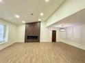 Bright, open living room with modern fireplace, wood floors, and vaulted ceilings at 850 Greenhedge Dr, Stone Mountain, GA 30088
