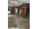 Spacious living room with brown walls and white ceiling beams at 3090 Alberta Dr, Marietta, GA 30062