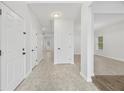 Bright and spacious entryway featuring neutral tile flooring, fresh white paint and multiple doors at 3405 Summer Brooke Way, Union City, GA 30291