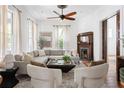 Bright living room with large windows, neutral furniture, and a decorative fireplace, creating a cozy atmosphere at 694 Peeples Sw St, Atlanta, GA 30310