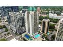 Stunning aerial view of a high-rise building with pool and tennis court amenities at 1280 W Peachtree Nw St # 4003, Atlanta, GA 30309