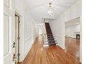 Welcoming foyer with hardwood floors, staircase, and elegant lighting at 1781 Point Pleasant Se, Smyrna, GA 30080