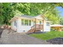 Side view of a charming home featuring a lush lawn and fresh exterior paint at 2879 Harlan Dr, Atlanta, GA 30344