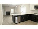 Open-concept kitchen featuring stainless steel appliances and island with sleek countertops at 623 Shadowmoore Dr, Riverdale, GA 30274