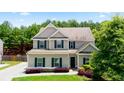 Charming two-story home with manicured lawn and mature trees at 405 Blue Sky Circle Cir, Acworth, GA 30102