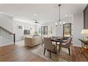 Bright and airy living room with modern furnishings, seamlessly connected to the dining area at 945 Willingham Dr # 3, Hapeville, GA 30354