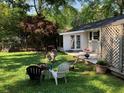 Inviting backyard with patio area, outdoor seating, and a well-maintained lawn at 2920 Appling Dr, Atlanta, GA 30341