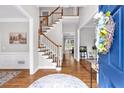 Inviting foyer with hardwood floors, staircase, and stylish decor at 6236 Millstone Trl, Douglasville, GA 30135