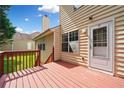 Cozy back porch features wood floors and a door to access the house at 1030 Carriage Trace Cir, Stone Mountain, GA 30087