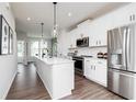 Modern kitchen features white cabinets, stainless steel appliances, and a center island at 2682 Brookview Nw Ln, Atlanta, GA 30318