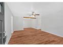 Bright living room featuring wood floors, ceiling fan, and neutral paint at 69 Southern Trace Way, Rockmart, GA 30153