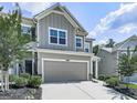 Inviting two-story home features a gray exterior, attached two-car garage, and well-maintained landscaping at 5512 Cascade Run, Atlanta, GA 30336