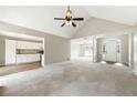 Open-concept living room with vaulted ceiling and arched entry, great for entertaining and gatherings at 75 Fox Chase, Covington, GA 30016