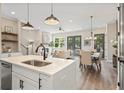 Open concept living and dining room with fireplace and ample natural light creates an inviting and stylish space at 937 Willingham Dr # 7, Hapeville, GA 30354