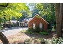 Attractive brick home with black shutters and landscaping at 2030 Buford Dam Rd, Buford, GA 30518