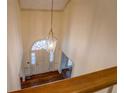 Bright and airy foyer featuring hardwood floors and an elegant chandelier, offering a grand entrance at 1216 Valley Dr, Conyers, GA 30012