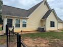 Charming home featuring vinyl siding, a well-maintained roof, and a fenced yard, perfect for outdoor living at 521 Deadwood Trl, Locust Grove, GA 30248