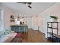 Open floor plan living area connecting living room and kitchen with hardwood floors throughout at 824 Greenwood Ne Ave # 8, Atlanta, GA 30306