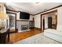 Cozy living room featuring hardwood floors, a decorative fireplace, and built-in shelving at 19 Wyman Se St, Atlanta, GA 30317
