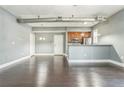 Open-concept living area features hardwood floors, a modern design, and a view of the kitchen at 502 Pryor Sw St # 6, Atlanta, GA 30312