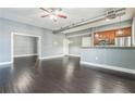 Open-concept living area features hardwood floors, a modern design, and a view of the kitchen at 502 Pryor Sw St # 6, Atlanta, GA 30312