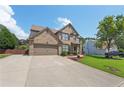 Attractive brick home with a well-manicured lawn and two-car garage, set against a blue sky at 852 Van Briggle Path, Sugar Hill, GA 30518