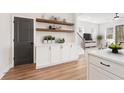 Well-appointed kitchen showcasing custom cabinetry and floating shelves at 927 Willingham Dr # 12, Hapeville, GA 30354