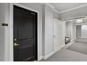 Hallway with neutral walls, carpet, and trim leading to unit 1502 at 2828 Peachtree Nw Rd # 1502, Atlanta, GA 30305