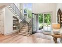 Grand foyer boasts high ceilings, elegant staircase, and an abundance of natural light at 298 Saint Marys Nw Ln, Marietta, GA 30064