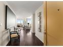 Modern hallway featuring dark wood floors and city views through expansive windows at 3325 Piedmont Ne Rd # 2006, Atlanta, GA 30305