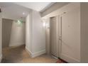 Apartment hallway with neutral carpet and wall finishes, leading to exit signs at 3325 Piedmont Ne Rd # 2006, Atlanta, GA 30305