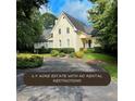Elegant two-story home with lush landscaping and a circular driveway on a 1.9 acre estate at 1417 Doe Valley Dr, Lithonia, GA 30058