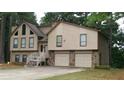 Charming home featuring a two-car garage and beautiful architectural details at 2297 Horseshoe Bend Sw Rd, Marietta, GA 30064