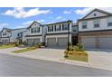 Exterior view of a new townhome with two car garage at 3560 Bexton Dr, Duluth, GA 30097