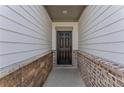 Close-up of an elegant front door with brick accents at 3560 Bexton Dr, Duluth, GA 30097