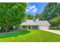 Beautiful single-story home with a well-maintained lawn and traditional architectural details at 230 Belmont Trl, Covington, GA 30016