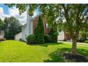 Well-maintained home with lush lawn and mature trees in a quiet neighborhood at 3332 Chastain Landings Ct, Marietta, GA 30066