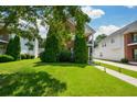 Beautifully landscaped lawn, trees, and garden space in front of this home at 3332 Chastain Landings Ct, Marietta, GA 30066