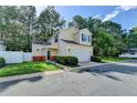 Charming two-story home with a two-car garage and well-maintained front lawn at 609 Bedford Court, Woodstock, GA 30188