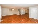 Spacious living room featuring gleaming hardwood floors, abundant natural light, and neutral paint at 1112 Smith St, Atlanta, GA 30310